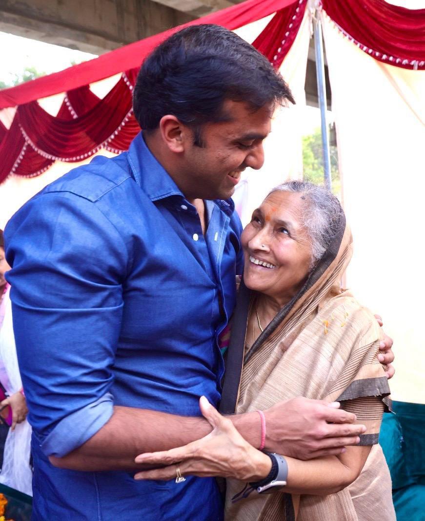 A son embracing his mother, receiving her blessing